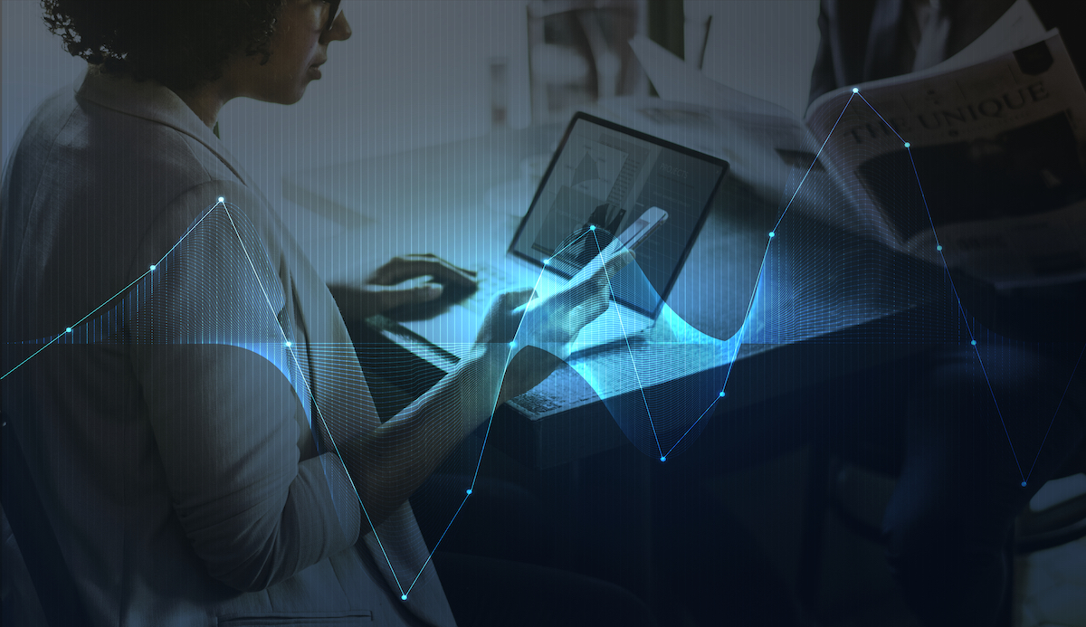 Businesswoman using a tablet with digital data visualization lines overlaid, representing data analytics and networking.