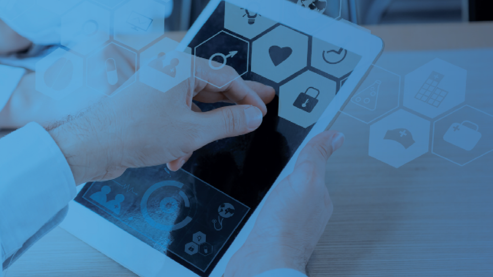 Person using a tablet with digital health and security icons overlaid, representing healthcare technology integration.