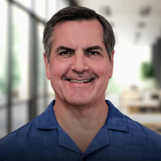 Professional headshot of Keith, a Validic employee, smiling in a blue polo shirt.