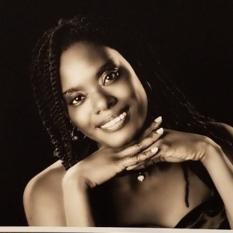 Professional portrait of Toni Connelly, a Validic employee, in sepia tone.