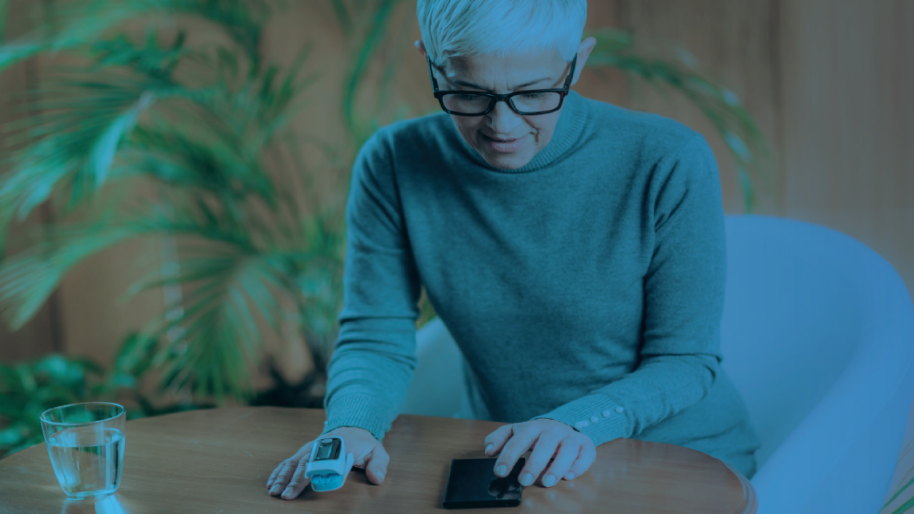 Person using a pulse oximeter and smartphone to check health readings, with a blue overlay.